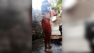 Beautiful desi cute girl's bath scene. Showering and dress changing in open village bathroom - 3 image