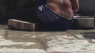 Desi sister-in-law is taking a bath in an open bathroom near the road on the edge of the forest on the farm - 8 image